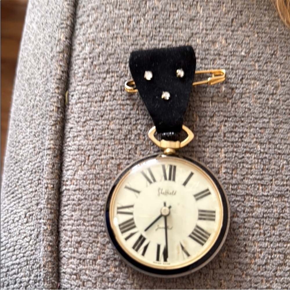 vintage Sheffield‎ Home black and gold pocket watch.